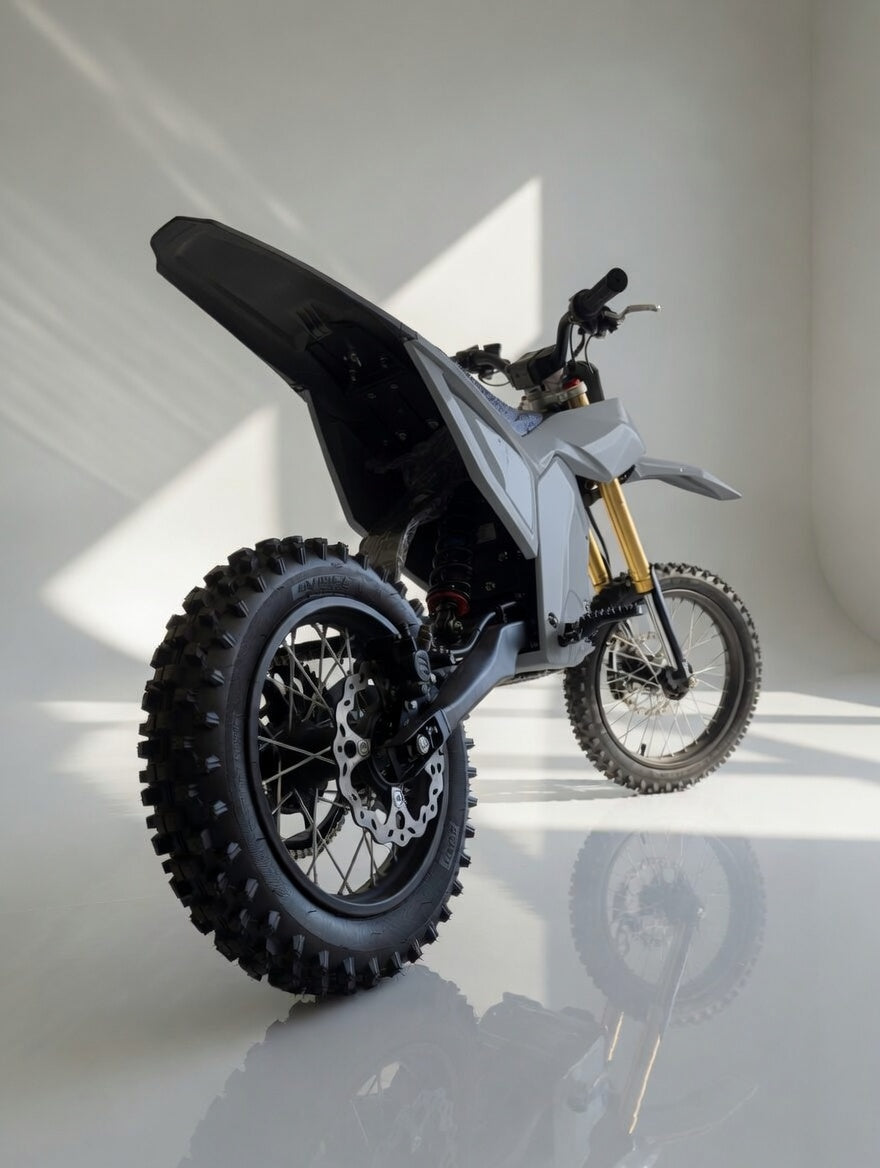 78 FORGED Phase I Gray electric dirt bike rear three-quarter view
